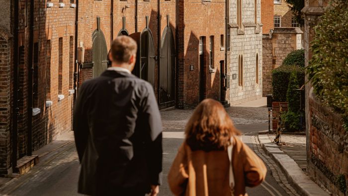 couple walking down a street in Windsor