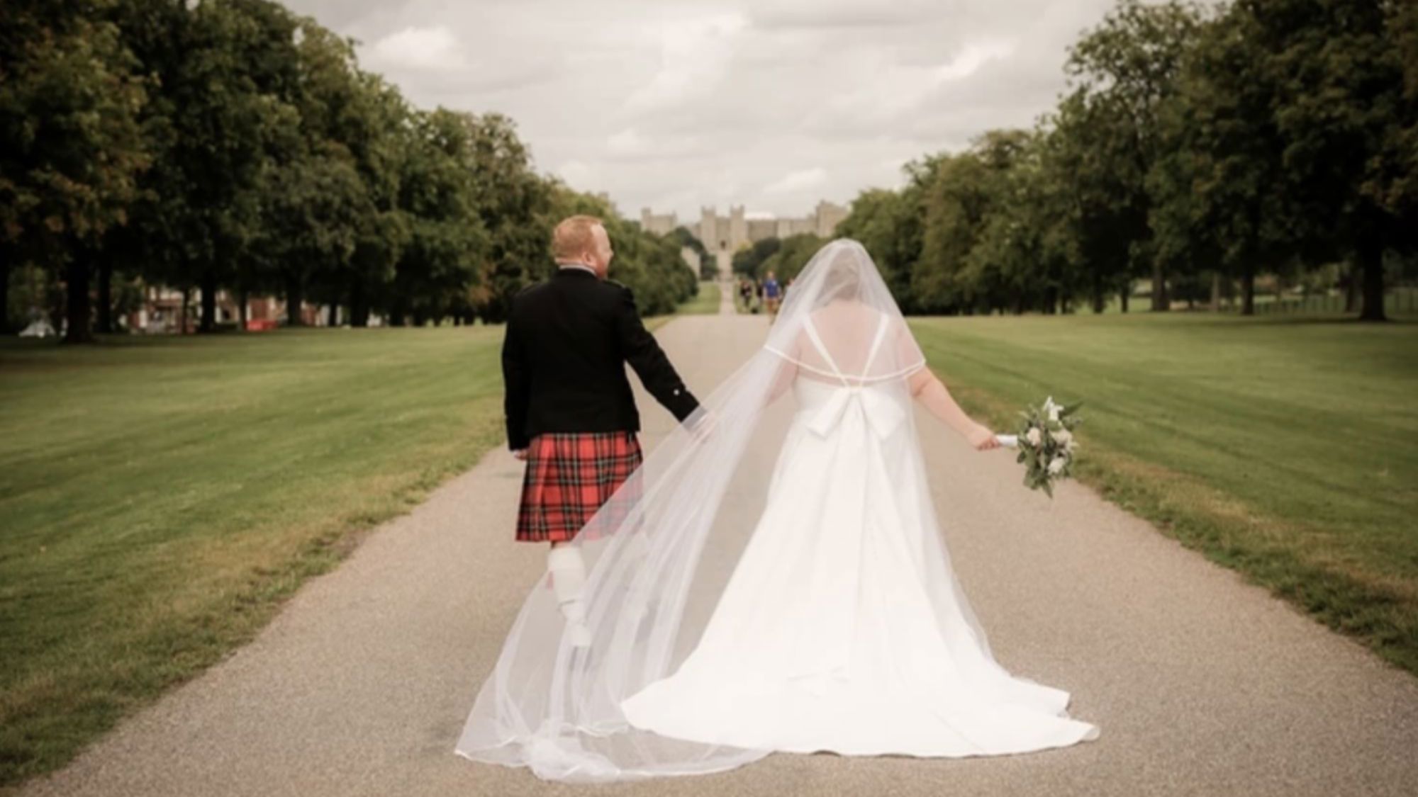 Couple walking down Long Walk