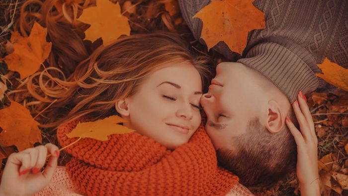 Couple in autumn leaves