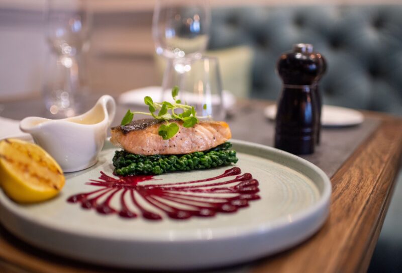 Salmon dish on the table of the restaurant at The Castle Hotel