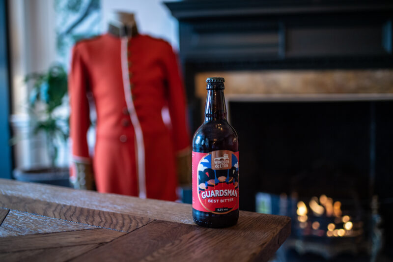 Bottle of Windsor Eton Brewery by the fireplace