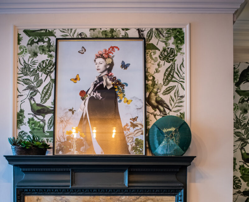 Image of the Queen above the fireplace at The Castle Hotel