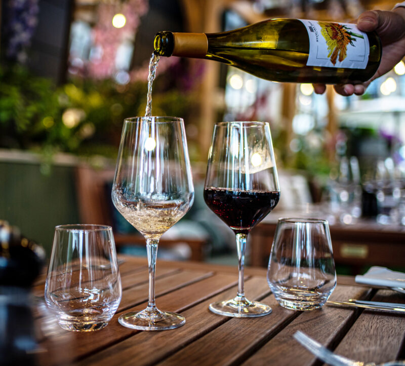 Wine being poured outside terrace area at The Castle Hotel