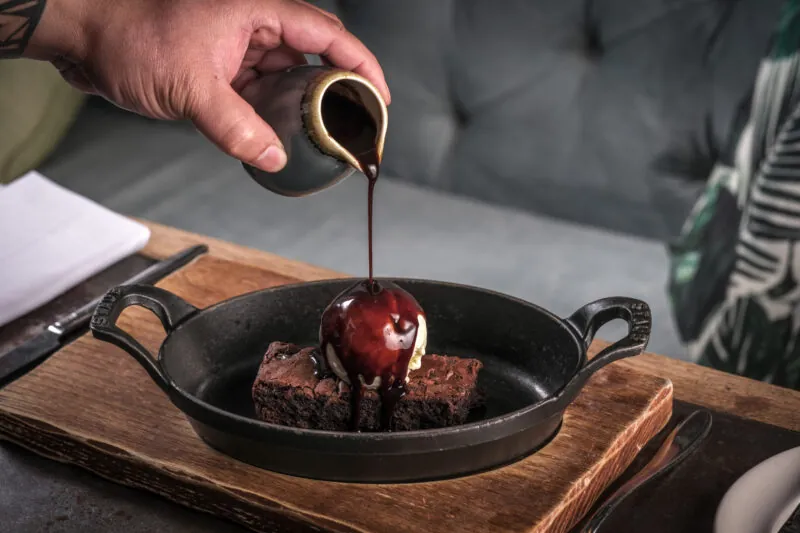 Brownie with poured chocolate sauce