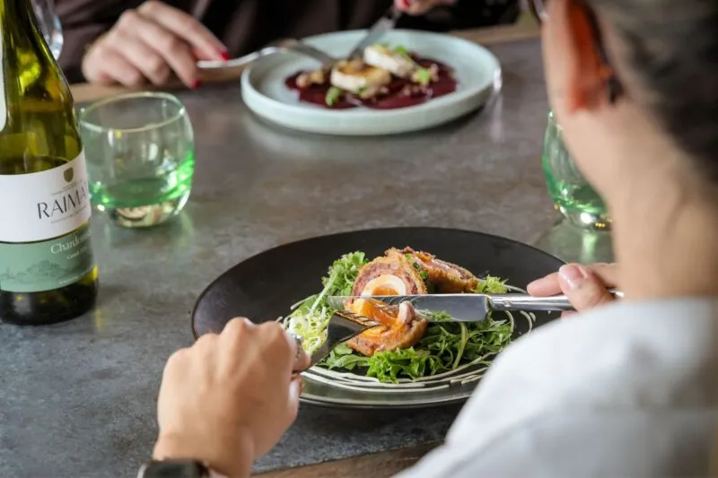 The Castle Hotel Windsor couples eating starters in Leaf