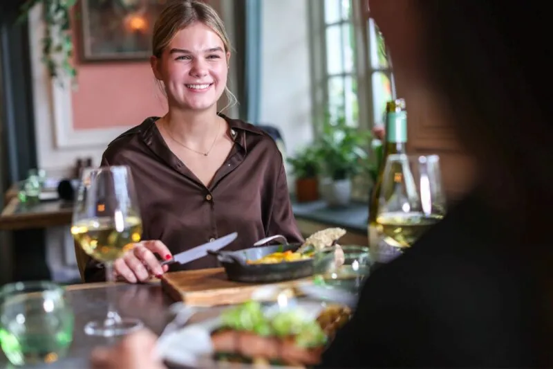 The Castle Hotel Windsor smiling lady eating in Leaf