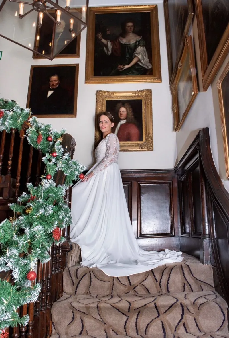 Bride on stairs at Christmas