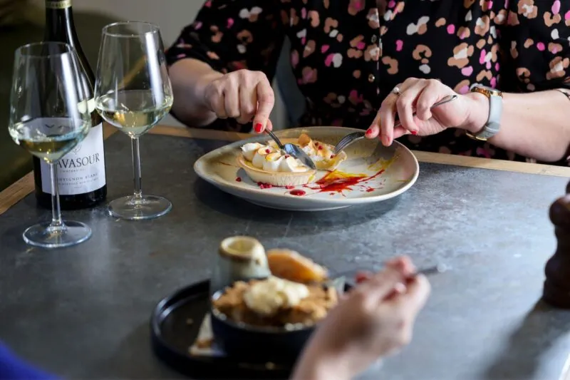 Couple eating desserts close up