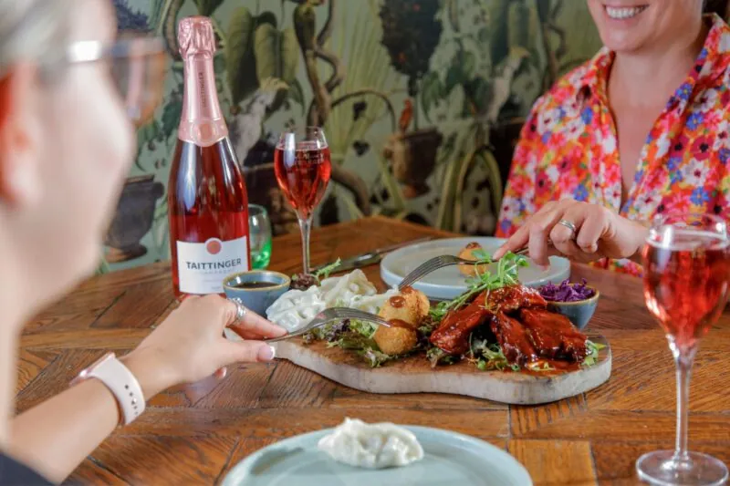 The Castle Hotel Windsor friends enjoying a sharing platter with wine